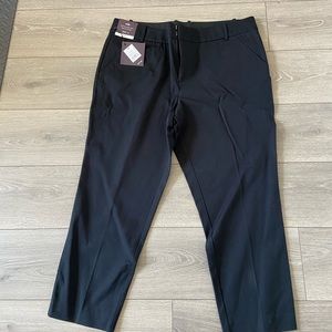 Never worn- stretchy slacks with front pockets.